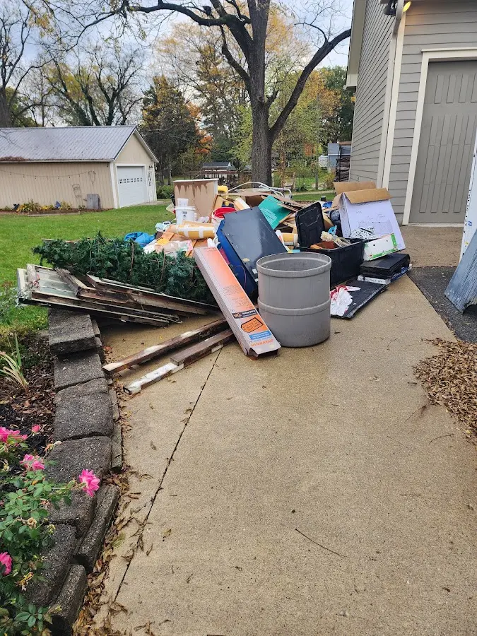 Dumpster being loaded with debris for Estate Cleanout Dumpster Rental in Berkley